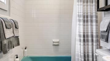Combined shower/bathtub, hair dryer, towels, soap