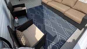 A rooftop deck with outdoor furniture, including a sofa, chairs, and a table. - Perfect spot! Cape Cod -1 block to beach and bay with views! (Beach Haven)