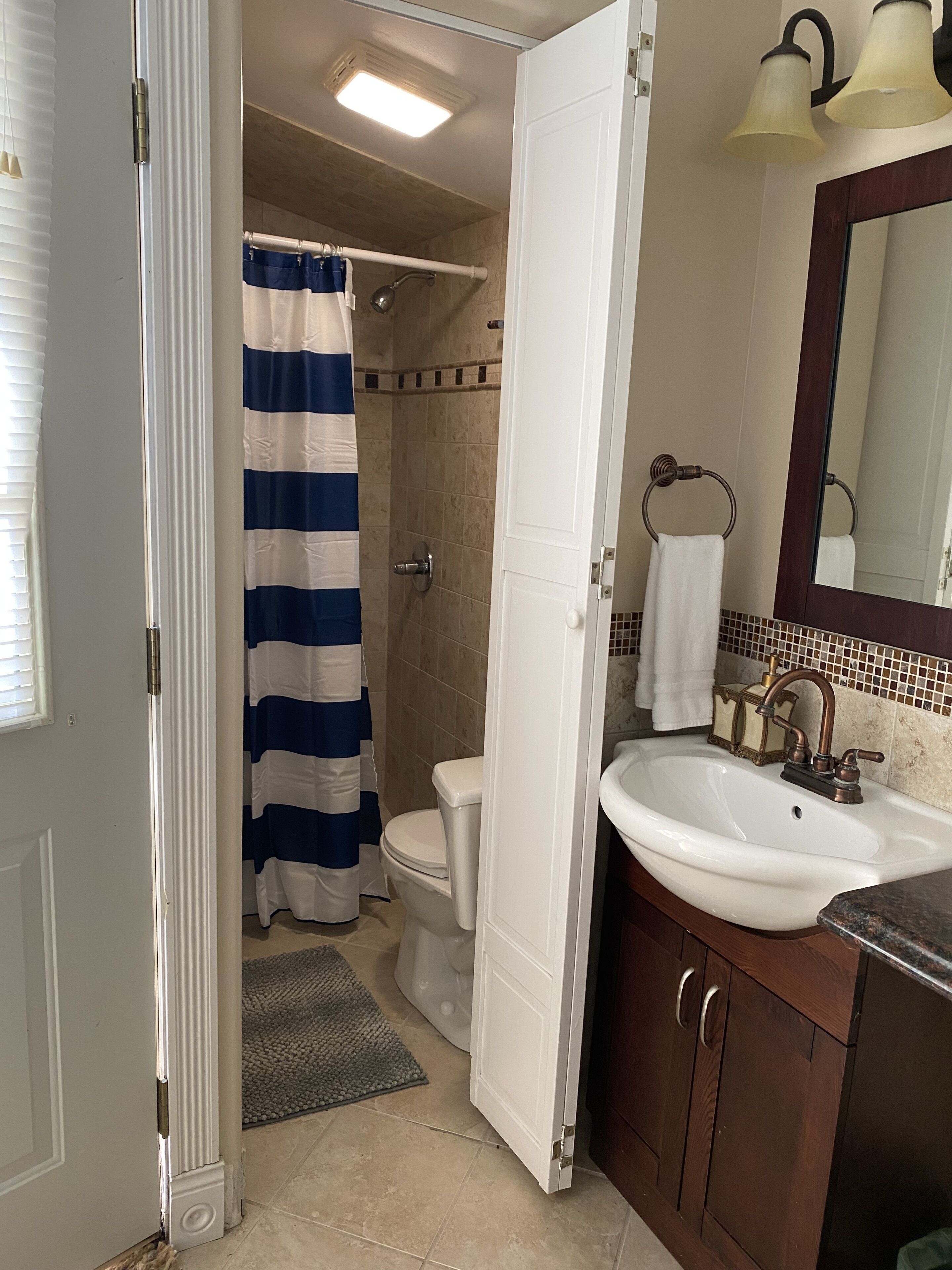 Shower, towels, soap, toilet paper