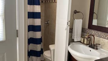 Shower, towels, soap, toilet paper