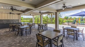 Outdoor dining - Stunning 3BR Modern Retreat, 20min to Beaches & Downtown, Pondside Bliss (Bradenton)