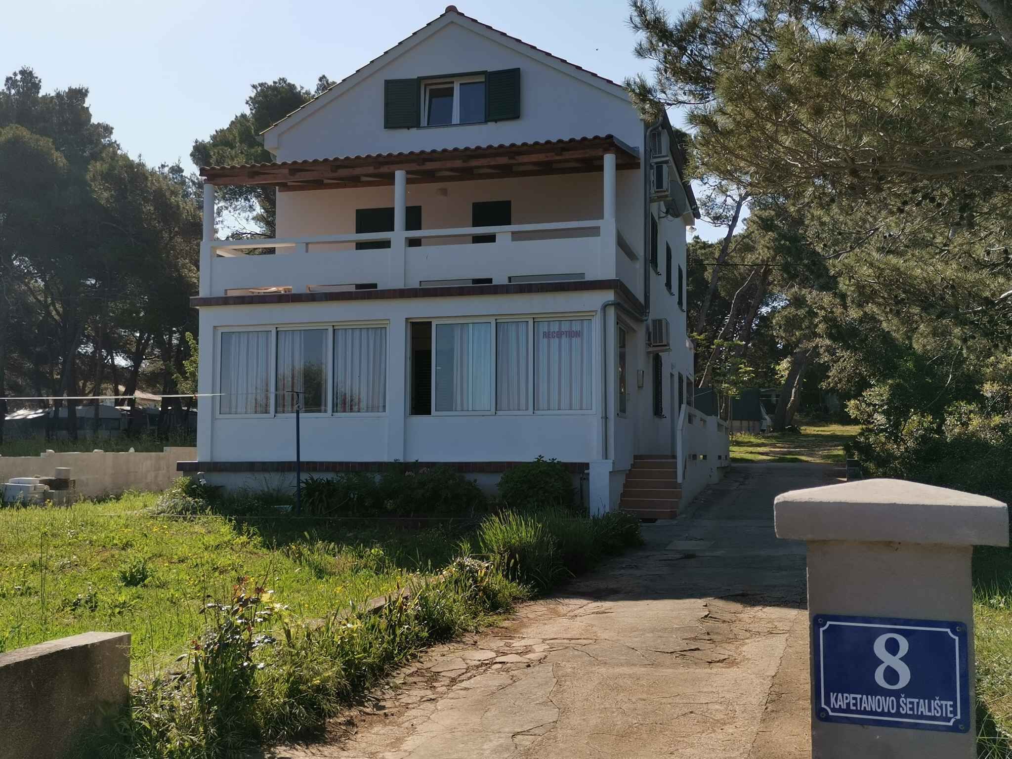 A two-story building with a reception area, located at KAPETANOVO SETALISTE, number 8.