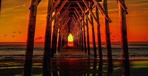 A pier leading to a sunset over the ocean. - Ocean Isle Beach Getaway Is A Slice Of Heaven (Ocean Isle Beach)