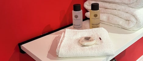 Premium bedding, memory-foam beds, laptop workspace, blackout curtains