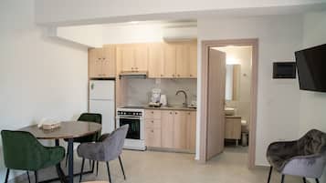 Comfort Apartment | Living area | TV