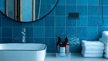 Quadruple Room | Bathroom | Rainfall showerhead, free toiletries, hair dryer, slippers