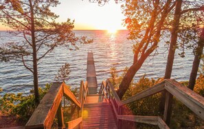 Staircase leads down to a serene waterfront view.