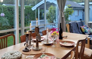Enjoy a romantic meal in this serene outdoor dining area with a view of the surrounding landscape.