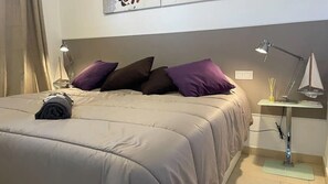 1 bedroom, desk, iron/ironing board, travel crib