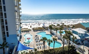 A resort with multiple swimming pools, a beach, and a view of the ocean. - Master Gulf View 5 Pools & Hot Tub w/ Pickleball & Free Beach Chairs (Panama City Beach)