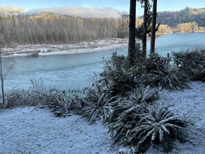 A snowy landscape with a river, trees, and a mountain in the background. - Spacious North Cascades Riverside A-Frame w/ Mt Baker Views - Dog-Friendly (Concrete)