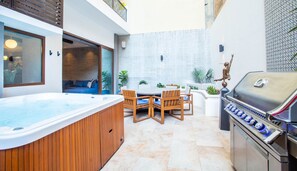 Large Private Patio with Jacuzzi, BBQ, Dining, and Lounging Areas