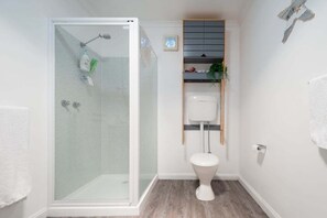 Shower, hair dryer, towels, shampoo