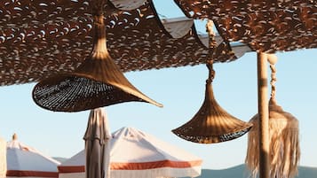 Private beach, free beach cabanas, beach shuttle, sun loungers