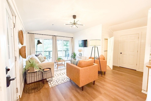 The living area is on the upper level with plenty of natural light.