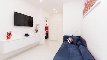 Deluxe Apartment | Living area | 40-inch Smart TV with digital channels, TV