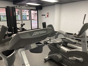 A gym with Life Fitness equipment, including treadmills and weight machines.