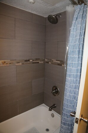Combined shower/bathtub, hair dryer, towels, soap