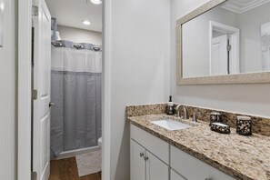 Combined shower/tub, hair dryer, towels, soap