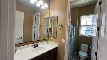 Combined shower/tub, hair dryer, towels, soap