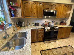 Fridge, microwave, oven, stovetop - Gorgeous Beach town-Tropical Private heated Pool & Tiki Lanai Close to Beaches! (Largo)