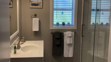 Shower, hair dryer, towels, soap