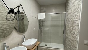 A modern bathroom with two sinks, a glass shower enclosure, and a wooden vanity. - RURAL HOUSE TOLEDO/MADRID (Borox)