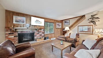Townhome | Living area | 42-inch flat-screen TV with satellite channels, TV, fireplace