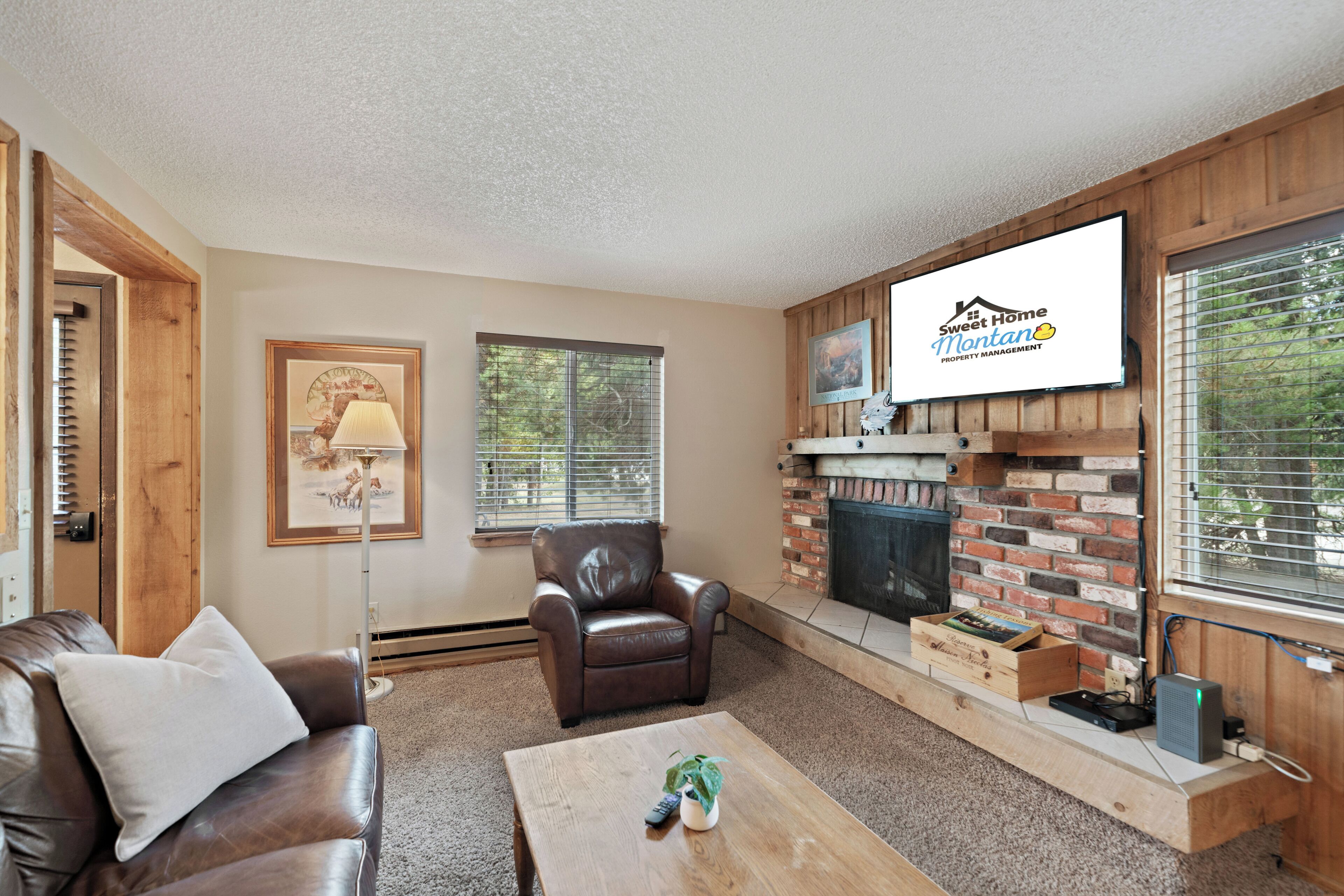 Townhome | Living area | 42-inch flat-screen TV with satellite channels, TV, fireplace