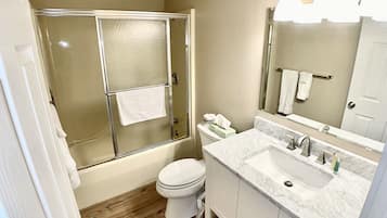 Combined shower/bathtub, hair dryer, towels, soap