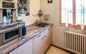 Fridge, stovetop, coffee/tea maker, cookware/dishes/utensils