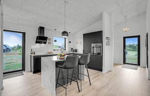 Fridge, stovetop, dishwasher, coffee/tea maker
