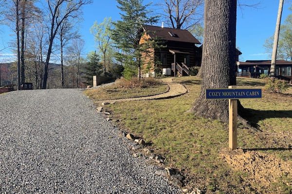 Cabin sits on host's 34-acre mountain property. Private guest driveway/parking.