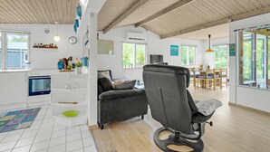 A spacious living area with a modern kitchen, a dining area, and a large window offering a view of the outdoors. - 2 bedroom nice home in Vordingborg (Vordingborg)