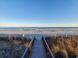 A wooden boardwalk leading to a beach with a clear sky. - Myrtle Beach Resort Unit 6201 - Ocean Getaway (Myrtle Beach)