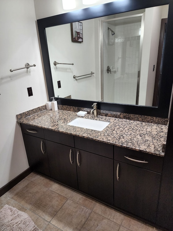 Bathtub, hair dryer, towels, soap