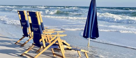 On the beach, sun-loungers, beach towels
