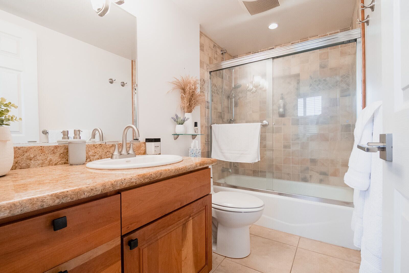 Combined shower/tub, hair dryer, towels, soap