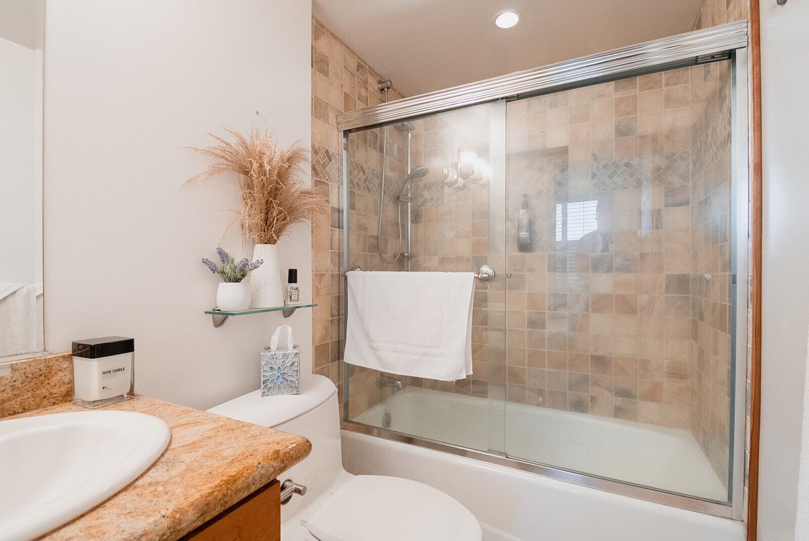 Combined shower/tub, hair dryer, towels, soap