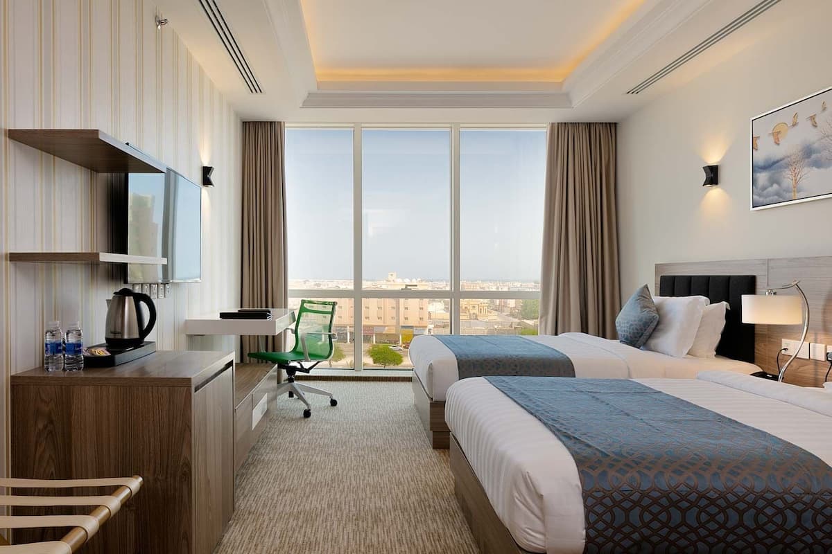 Deluxe Twin kamer | 1 slaapkamer, een minibar, een bureau, geluiddichte muren