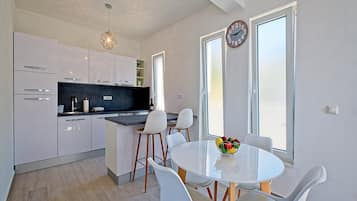 Apartment (One Bedroom Apartment with Balcony an) | Private kitchen | Fridge, dining tables