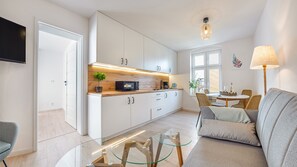 Apartment (3C) | Living area | 30-inch plasma TV with cable channels, TV