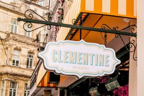 A sign for 'Clementine Patisserie' hanging from a metal structure. - Ring Stone Hotels Bosphorus (Istanbul)