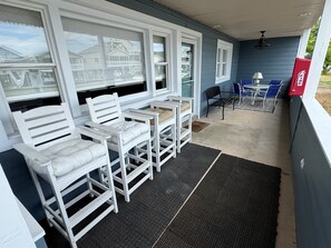 Outdoor dining - Charming 2BR condo in Sunset Beach, perfect for 6 guests. Enjoy the patio! (Sunset Beach)