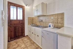 Mini-fridge, stovetop, cookware/dishes/utensils