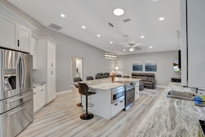 Enjoy meals in the kitchen with a central island, oven, and dining area.