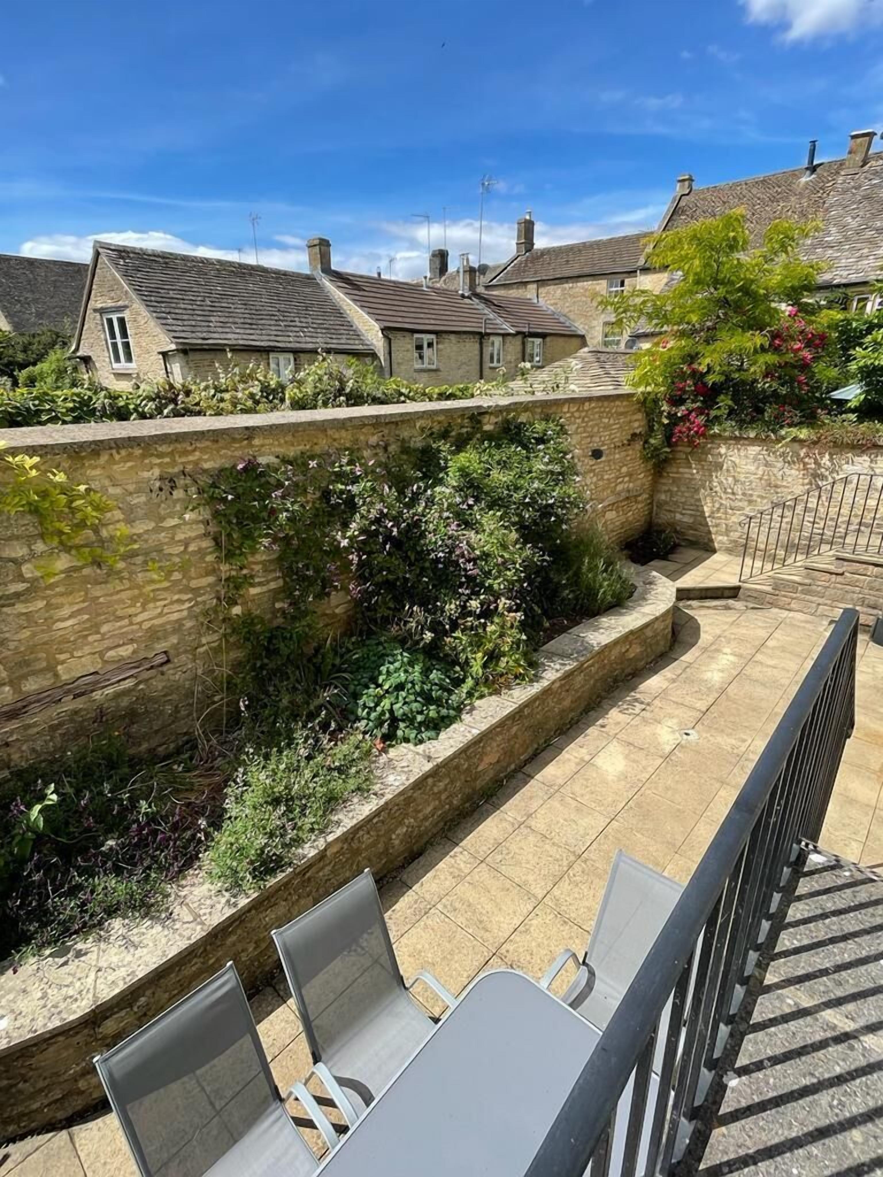 Courtyard garden from top of steps to sitting room french doors
