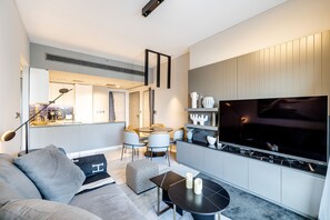 Premier Apartment | Living area | 48-inch Smart TV with cable channels, TV - MAG 318 Business Bay Dubai (Dubai)