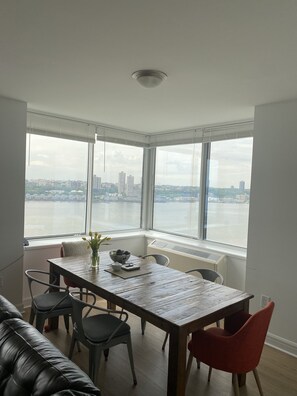 Enjoy a meal for two in this stylish dining area with a city view.