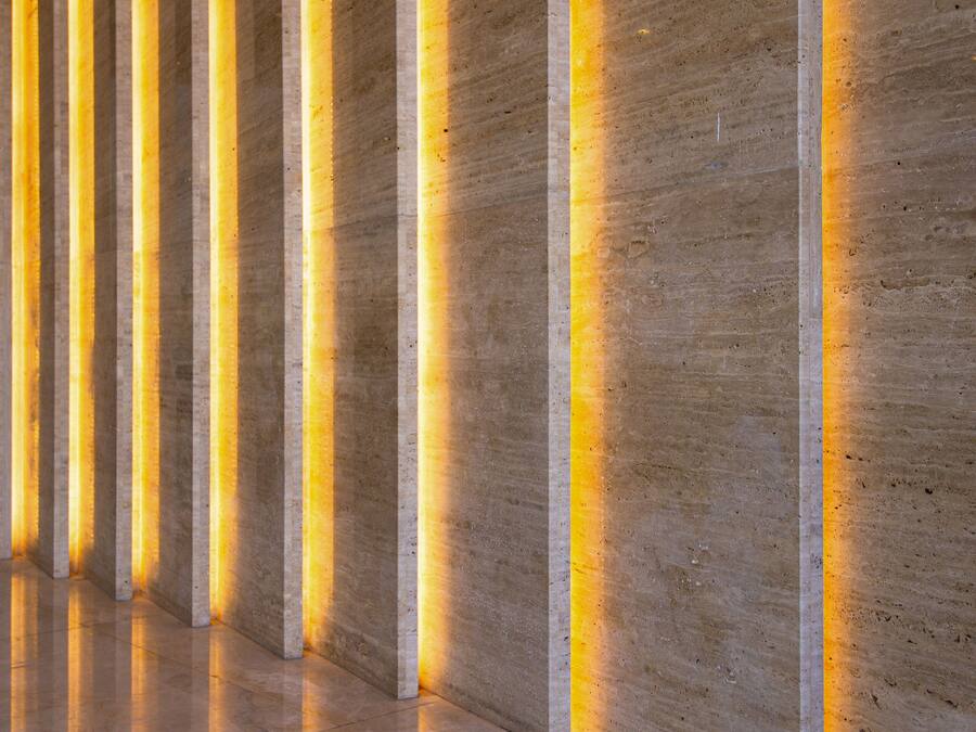 A set of marble steps with illuminated vertical lines.